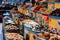 Bustling outdoor market with a variety of containers filled with spices