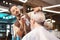 Busy barber doing modern hairstyle