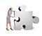 Busy businesswoman pushing puzzle piece