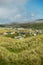 Busy caravan park with many tents, motor homes and caravans, Warm sunny day.