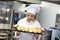 Busy chef at work in the restaurant kitchen