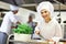 Busy chefs at work in the restaurant kitchen