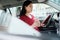 Busy Chinese Business Woman Working In Car With Tablet