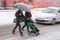 Busy city people on zebra crossing in motion blur. Winter snowy day