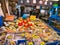 A busy, colourful fish market stall selling fresh fish, seafood and crab products in Tokyo, Japan