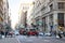 Busy crowds of people walking across a crowded street in the SoHo neighborhood of Manhattan New York City