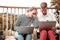 Busy freelancers holding laptops and looking tired