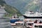 Busy harbour at Geiranger with various tour boats