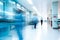 A busy hospital corridor with doctors and nurses walking. Long exposure motion blur