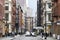 Busy intersection of Broome and Greene Streets is crowded with people and cars in the SoHo neighborhood of New York City