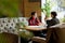 Busy ladies talking in modern cafe