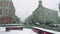 Busy large avenue in Moscow with cars rushing here and there during hard snowfall