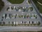 Busy large modern carpark with symmetrical roads rows of parking bays lots of symmetry and colours aerial view from
