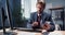 Busy man using smartphone and computer for work at office