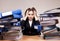 Busy manager. Businesswoman with stack of folders and documents