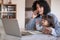 Busy mother and entrepreneur working at home with her daughter