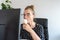 A busy office woman eats ice cream at her workplace without interrupting work