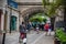 Busy pedestrian street under the bridge.