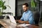 Busy professional business man using laptop working at office workplace desk.