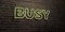 BUSY -Realistic Neon Sign on Brick Wall background - 3D rendered royalty free stock image