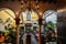 Busy restaurant courtyard in Seville, Spain with traditional Moorish arches