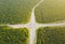 Busy Road junction in the middle of green palm plantation, view