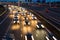 Busy rush hour traffic leaves light trails on the A9 highway