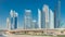Busy Sheikh Zayed Road timelapse, metro railway and modern skyscrapers around in luxury Dubai city
