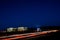 Busy Silicon Valley Night Freeway and Office Cityscape