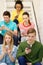 Busy students with smartphones sitting on stairs