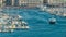 Busy traffic in Old Port of Marseille, boats sailing into open sea, timelapse