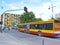 Busy traffic on streets of Polish city Lodz. articulated bus going on city road