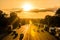 Busy traffic on uk motorway road overhead view at sunset