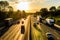 Busy traffic on uk motorway road overhead view at sunset