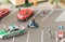 Busy urban life with miniature people and automobiles on a busy street