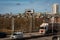 Busy urban road with truck and cars at toll station in Stockholm.