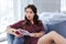 Busy woman feeling relaxed while reading book