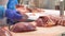 Butcher cutting beef by the conveyor belt