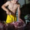 Butcher cutting pork meat on kitchen, chef cutting fresh raw meat on table