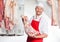 Butcher Holding Meat In Butchery