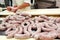 Butcher making fresh spicy salami sausage