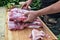 Butcher prepares meat for rolled roast pork