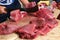 Butcher prepares a tuna stack in Funchal fish market, Madeira