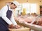 Butcher Preparing Meat In Shop