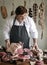 Butcher selling meat in a butcher shop food photography recipe idea