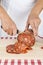 Butcher slicing a Spanish sausage called morcon