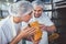 Butchers checking the quality of smoked meat