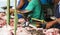 Butchers cutting meet in an outdoor market in Havana Cuba