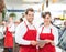 Butchers With Digital Tablet Standing In Store