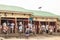 Butchers offering meat on Meat Center, Uganda. Marabu stork on roof waiting for meat waste